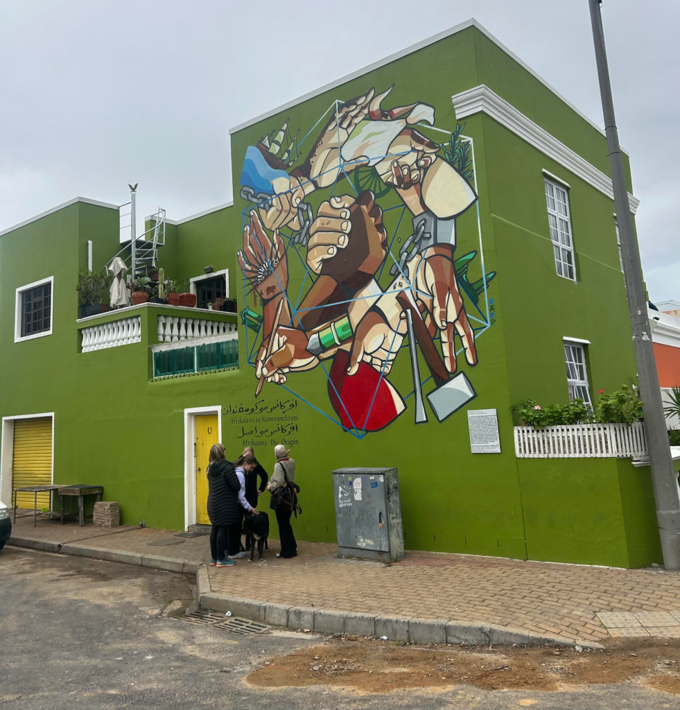 A building with a mural in the Bo Kaap neighbourhood of Cape Town which can be visited during a 3-Week South Africa itinerary