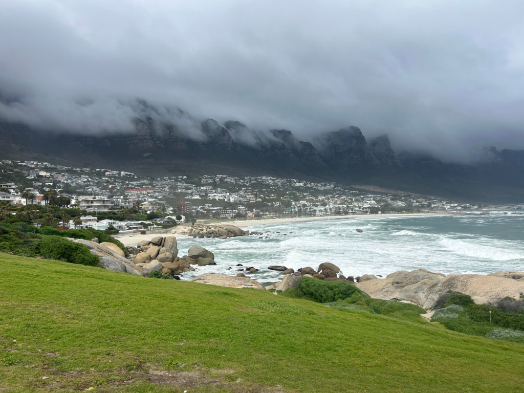 Clouds over Table Mountain at Camps Bay beach in Cape Town