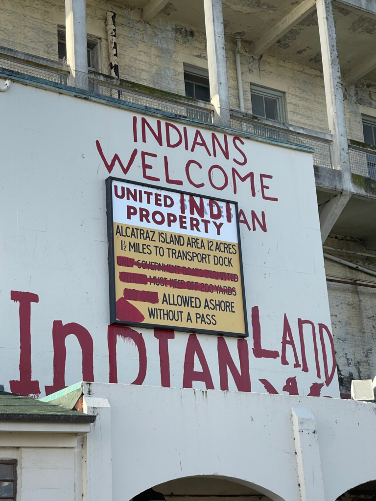 Painted on sign at Alcatraz sayings "Indians Welcome United Indian Property Indian Land"