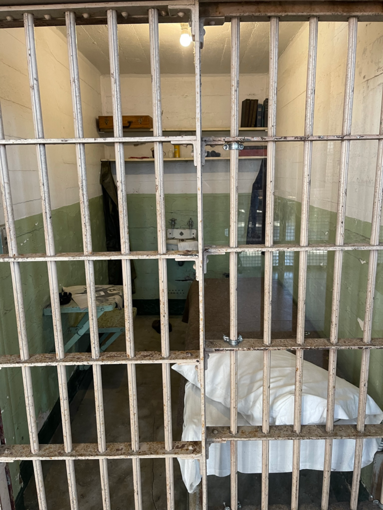 View of a cell behind bars in the Cellhouse at Alcatraz in San Francisco.