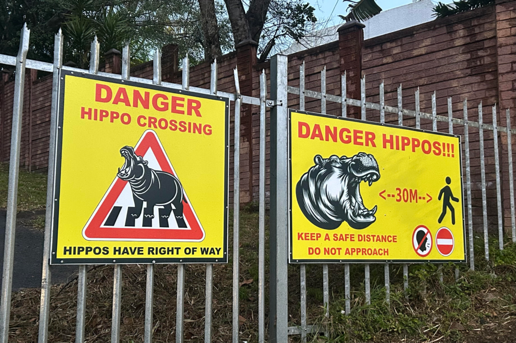 Hippo warning signs in St Lucia, KwaZulu-Natal Province, South Africa