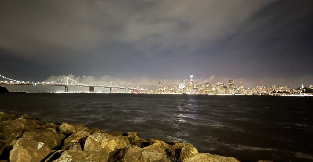 The San Francisco skyline and San Francisco-Oakland Bay Bridge at night viewed from Treasure Island on the Big Bus Tours San Francisco night tour.