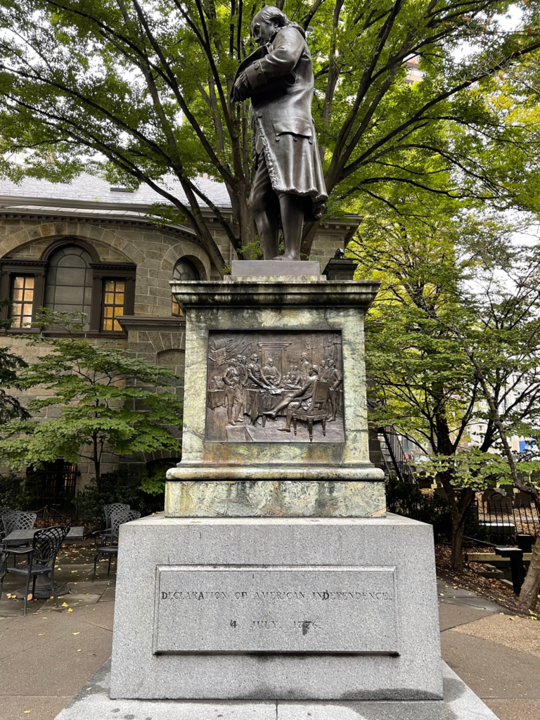 A statue of Benjamin Franklin near the original location of the Boston Latin School.
