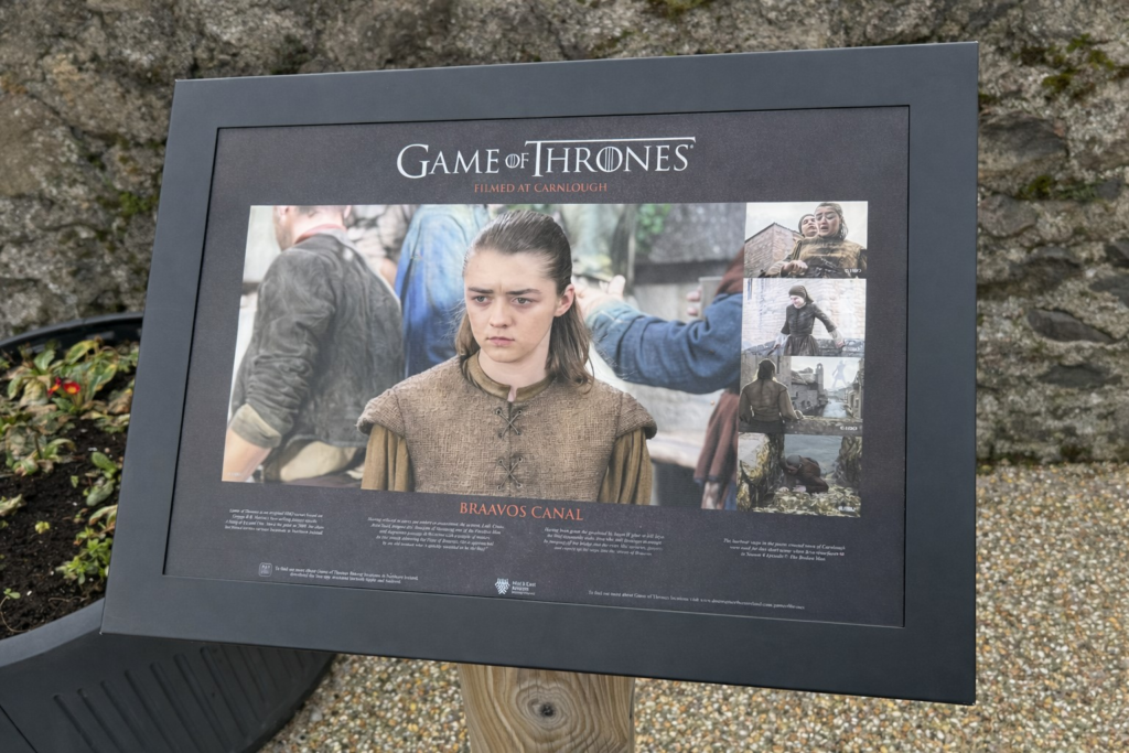A board depicting the Game of Thrones scenes filmed at Carnlough Harbour along the Causeway Coastal Route.